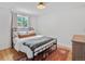 Bedroom with large window for natural light and wood flooring at 3030 Alkire St, Golden, CO 80401