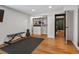 Bright exercise room with wood floors, bench, weights, and natural light, ready for your workout routine at 3030 Alkire St, Golden, CO 80401