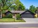 Charming home exterior featuring a well-manicured lawn, and an attached two car garage at 3030 Alkire St, Golden, CO 80401