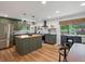 Modern kitchen featuring an island with a butcher block countertop and stainless steel appliances at 3030 Alkire St, Golden, CO 80401