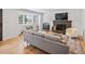 Cozy living room featuring hardwood floors, a stone fireplace, and lots of natural light at 3030 Alkire St, Golden, CO 80401