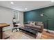 Cozy living room with hardwood floors, a modern couch, and a stylish floor lamp, perfect for relaxing at 3030 Alkire St, Golden, CO 80401