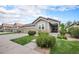 Charming two-story home with a well-manicured lawn, lovely landscaping, and a two-car garage at 13942 W 87Th Dr, Arvada, CO 80005