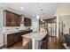 Spacious kitchen with a large granite island and stainless steel appliances at 13942 W 87Th Dr, Arvada, CO 80005