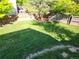 Spacious backyard with lush green grass, perfect for outdoor activities at 7190 Pine Hills Way, Littleton, CO 80125