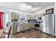 Kitchen with stainless steel appliances and wood cabinets at 7190 Pine Hills Way, Littleton, CO 80125