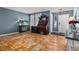 Living room with hardwood floors and a large rug at 7190 Pine Hills Way, Littleton, CO 80125