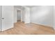 An airy bedroom featuring a walk-in closet and luxury vinyl plank flooring at 16517 W 92Nd Pl, Arvada, CO 80007
