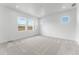 Bright bedroom with three large windows at 16517 W 92Nd Pl, Arvada, CO 80007