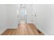 Hallway featuring luxury vinyl plank flooring and white doors at 16517 W 92Nd Pl, Arvada, CO 80007