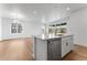 Modern kitchen featuring quartz countertops and a stainless steel dishwasher at 16517 W 92Nd Pl, Arvada, CO 80007