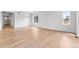 Open living area featuring hardwood floors and large windows for lots of natural light at 16517 W 92Nd Pl, Arvada, CO 80007