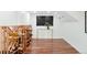 Finished basement features a wood wine rack, hardwood floors, TV, and modern decor at 3147 Vallejo St, Denver, CO 80211