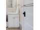Bathroom with marble vanity, decorative door hardware, and a towel rack at 3147 Vallejo St, Denver, CO 80211