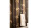 Bathroom towel and rack hang next to a patterned wall with elephant-themed wallpaper at 3147 Vallejo St, Denver, CO 80211