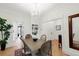 Dining room with a chandelier, hardwood floors, and direct access to the front entry at 3147 Vallejo St, Denver, CO 80211