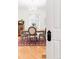 Dining room chandelier and door with ornate knob is visible in this bright airy room at 3147 Vallejo St, Denver, CO 80211