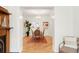 Open-concept dining room is adjacent to the living area and boasts hardwood floors, chandelier, and stylish decor at 3147 Vallejo St, Denver, CO 80211