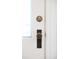 Close up of detailed antique doorknob on white door at 3147 Vallejo St, Denver, CO 80211