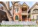 Charming two-story brick home with a covered front porch and balcony, showcasing its inviting facade at 3147 Vallejo St, Denver, CO 80211