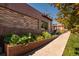 Commercial brick building with professional landscaping and healthy plants at 3147 Vallejo St, Denver, CO 80211