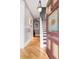 Bright foyer showcasing hardwood floors, decorative door, and a staircase leading to the upper level of the home at 3147 Vallejo St, Denver, CO 80211