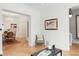 Living room with a hardwood floor is painted white with access to the dining room at 3147 Vallejo St, Denver, CO 80211