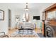 Elegant living room with natural light, fireplace, hardwood floors, and comfortable seating creating a warm and inviting space at 3147 Vallejo St, Denver, CO 80211
