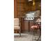 High-end outdoor grill with stone accents, wood cabinets, and patterned concrete floors at 3147 Vallejo St, Denver, CO 80211