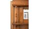 Close up of beautiful wood decor on the walls, complete with a mirror and carved accents at 3147 Vallejo St, Denver, CO 80211
