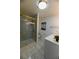 Bathroom featuring a glass shower with unique tile, a modern sink, and updated fixtures for a spa-like retreat at 409 N Finch Ave, Lafayette, CO 80026