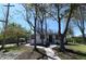 Inviting single-story house featuring a well-manicured lawn, pathway, and mature trees at 409 N Finch Ave, Lafayette, CO 80026