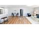 Bright and open-concept living space with hardwood floors, dining area and modern accents at 409 N Finch Ave, Lafayette, CO 80026