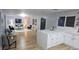 Open-concept living area featuring new flooring and lots of natural light at 409 N Finch Ave, Lafayette, CO 80026