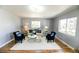 Cozy living room with bright windows, plush seating, and decorative wall art at 409 N Finch Ave, Lafayette, CO 80026