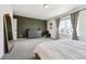 Cozy main bedroom with a walk-in closet, neutral paint, carpet and natural light at 10224 Worchester St, Commerce City, CO 80022