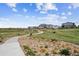 Picturesque community park with winding paths, lush greenery, and beautiful landscaping at 10224 Worchester St, Commerce City, CO 80022
