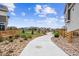 Well-maintained community park featuring a walking path with lush landscaping and fencing at 10224 Worchester St, Commerce City, CO 80022