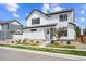 Charming two-story home with landscaped front yard and inviting entrance steps at 10224 Worchester St, Commerce City, CO 80022