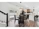 Bright eat-in kitchen featuring modern appliances, gray cabinets, and a view of the fenced backyard at 10224 Worchester St, Commerce City, CO 80022