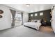 Spacious main bedroom with plush carpet, three windows, and an accent wall at 10224 Worchester St, Commerce City, CO 80022