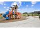 Fun playground featuring a slide, climbing area, and picnic tables for community enjoyment at 10224 Worchester St, Commerce City, CO 80022