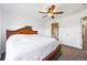 Cozy bedroom featuring ceiling fan and white bedding at 1522 Chimney Peak Dr, Castle Rock, CO 80109