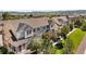 Townhome exterior featuring neutral siding, black shutters, and a well-manicured lawn at 1522 Chimney Peak Dr, Castle Rock, CO 80109
