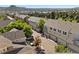 Townhome complex featuring a mix of colors, attached garages, and tree lined streets at 1522 Chimney Peak Dr, Castle Rock, CO 80109