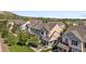 Townhome complex featuring neutral siding, black shutters, and well-manicured lawns at 1522 Chimney Peak Dr, Castle Rock, CO 80109
