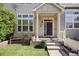 Welcoming front porch with comfortable seating and lush landscaping at 1522 Chimney Peak Dr, Castle Rock, CO 80109