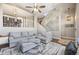 Spacious living room with ample seating, stylish decor, and staircase access at 1522 Chimney Peak Dr, Castle Rock, CO 80109