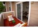 Outdoor balcony with seating overlooking views into an open dining area at 6845 S Webster St # E, Littleton, CO 80128