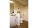 Well-lit bathroom features a vanity with granite counters and a shower-tub combo at 6845 S Webster St # E, Littleton, CO 80128